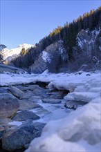 Inn or En near Scuol in winter, with ice floes, Engadin, Grisons, Switzerland, Europe