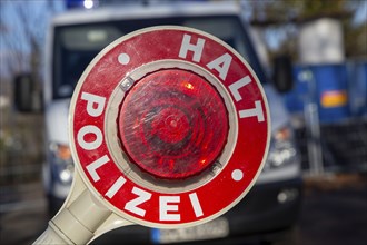 Police check: close-up of a police trowel with the inscription HALT POLIZEI in front of a police