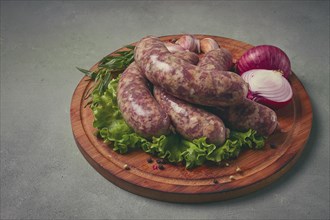 Raw kupaty, traditional Georgian sausages, raw sausages, with spices and herbs, Georgian cuisine