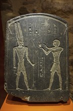 The Padichahededet stele showing Egyptian hieroglyphs and the god Amun dating to the 26th Dynasty