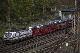 Freight train, car train with Landrover new cars on the goods train line at the Hagen-Vorhalle