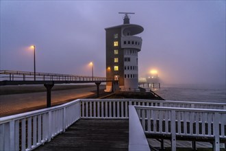 Thick fog in winter, hanging over the mouth of the Elbe into the North Sea, radar tower of the