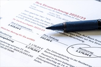 Symbolic image of electricity bill, billing of an electricity provider, additional payment due to