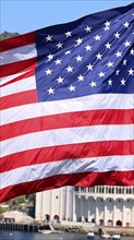 American star spangled flag waving in California. A large American flag is flying high above