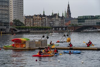 Summer evening in Copenhagen, at the harbour, Islands Brygge, people celebrating, eating, drinking,