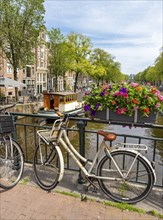 Bicycle on a bridge over the Prinsengracht canal, Prinsenstraat, Amsterdam, Netherlands