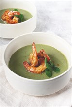 Pea cream soup, with shrimp, green soup, homemade, top view, no people