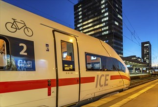 Railway station, ICE train on platform, skyline of Essen city centre, North Rhine-Westphalia,