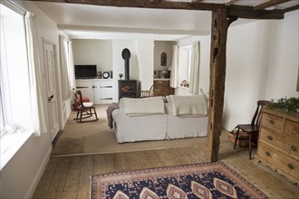 Property Released white painted interior of historic cottage living room, Suffolk, England, UK