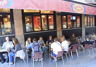 People drinking outside, Cerveceria 100 Montaditos chain bar pub, Madrid city centre, Spain, Europe