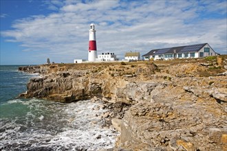 Red and white lighthouse on the coast at Portland Bill, Isle of Portland, Dorset, England, United