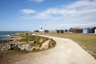 Red and white lighthouse on the coast at Portland Bill, Isle of Portland, Dorset, England, United