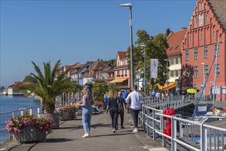 Meersburg on Lake Constance, lakeside promenade, jetty, plant pots, many people, house facades,