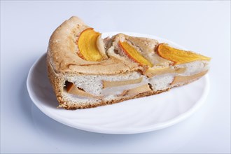 A slice of sweet persimmon pie isolated on white background. close up