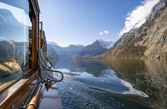 Tourist boat on the Königssee, Watzmann massif, autumnal mountain landscape reflected in the lake,