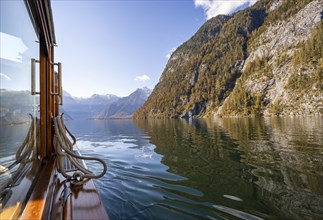 Tourist boat on the Königssee, autumnal mountain landscape reflected in the lake, Berchtesgaden