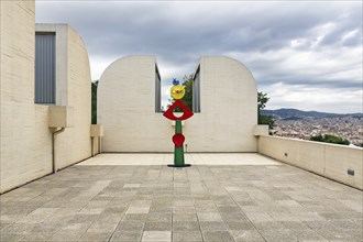 Colourfully painted bronze statue on a roof terrace, La carícia d'un ocell, Museum Fundacio Joan