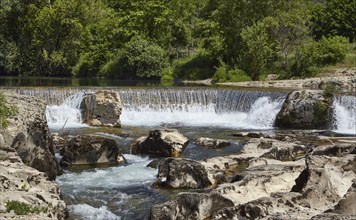 Waterfalls of the Cèze of the cascades of Sautadet through limestone cliffs in La Roque-sur-Cèze,