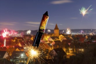 Photomontage, Ignited rocket, fireworks on New Year's Eve, view of Korb-Steinreinach in the Rems