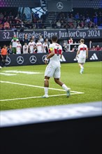 A young footballer on the pitch at a tournament, Mercedes Benz Junior Cup, Glaspalast Sindelfingen,