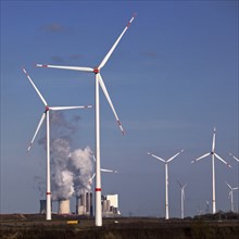 Wind turbines at the Garzweiler open-cast lignite mine with the Neurath power station in the