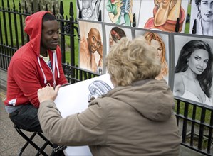 Street portrait artist, Leicester Square, London, England, UK