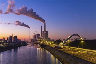 Mannheim coal-fired power station on a cold winter's day, plumes of smoke above the chimneys.