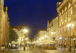 The medieval old town of Thorn illuminated in the evening. The historic city centre of Torun is a