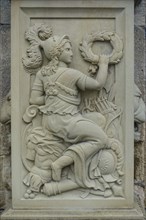 Relief, stone figure, female figure warrior with helmet and wreath at the gate portal, lower castle