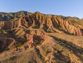 Aerial view, eroded mountain landscape, sandstone cliffs, canyon with red and orange rock