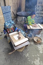 Vietnamese woman from the Hmong minority draw patterns on linen fabric, Lung Tam linen weaving