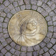 Medallion of the first King of Germany Henry the Fowler embedded in cobbled street, Meissen,