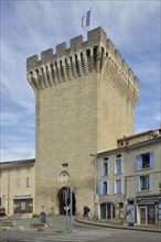 Porte d'Orange, city gate with battlements and French national flag, defence defence tower,