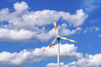 Wind turbine, wind energy plant from the manufacturer Enercon, blue sky with many white clouds,