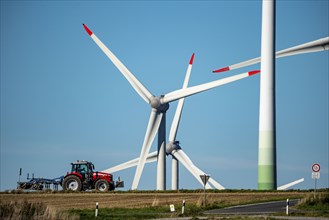 Wind farm near Lichtenau, wind turbines, country road, Driburger Straße, tractor at work in the