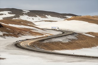 Truck on mountain road between Reykjahlid and geothermal area Hverarönd, winter, at mountain