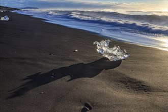 Ice floes on the beach, waves, sunny, morning mood, winter, Diamond Beach, Breidamerkursandur,