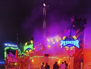 The illuminated Predator funfair at night, Cranger Kirmes, Herne, Ruhr area, North