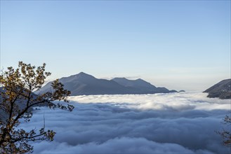 Mountain Range Above Cloudscape with Sunlight and Clear Sky in Lugano, Ticino in Switzerland