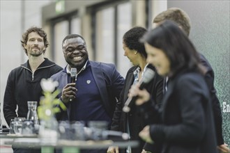 (L-R) Arne Friedrich, former professional football player, Gerald Asamoah, Steffi Jones, former