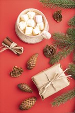 Christmas or New Year composition. Decorations, box, cinnamon, cones, fir and spruce branches, cup