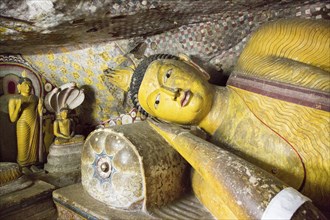 Buddha figures inside Dambulla cave Buddhist temple complex, Sri Lanka, Asia