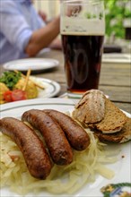 Smoked beer, and sausages with cabbage, food, Schlenkerla, the historic smoked beer brewery,