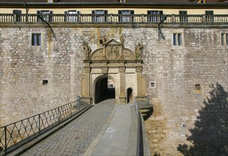 Portal, gate, round arch, bridge, cobblestones, stone figures, coat of arms, relief, decoration,