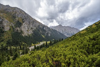 Green mountain valley with river and steep mountain peaks, Chong Kyzyl Suu Valley, Terskey Ala Too,