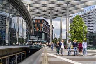 Station forecourt of Utrecht Centraal station, people on their way to, from the station,