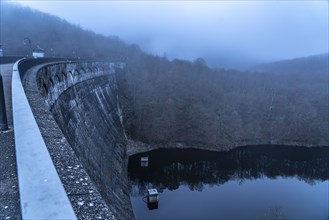 The dam wall of the Urft dam, in the Eifel, reservoir, in winter, fog, near Schleiden, North