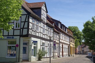 Residential and commercial buildings in Nicolaistraße, paved with cobblestones, in the old town