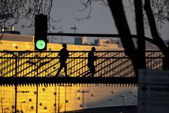 Jogger on a bridge over Segerothstraße, in Essen, behind Limbecker Platz shopping centre