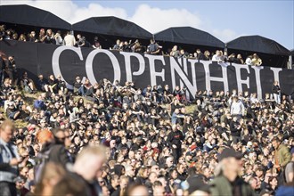 Festivalgoers in front of the logo at the Copenhell Metal Festival at Kløverparken Camping